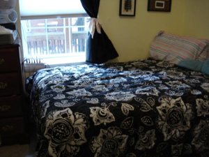 made bed next to window