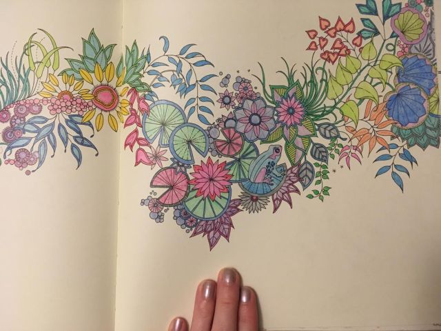 hand on a coloring book